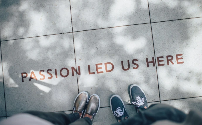 two person standing on gray tile paving