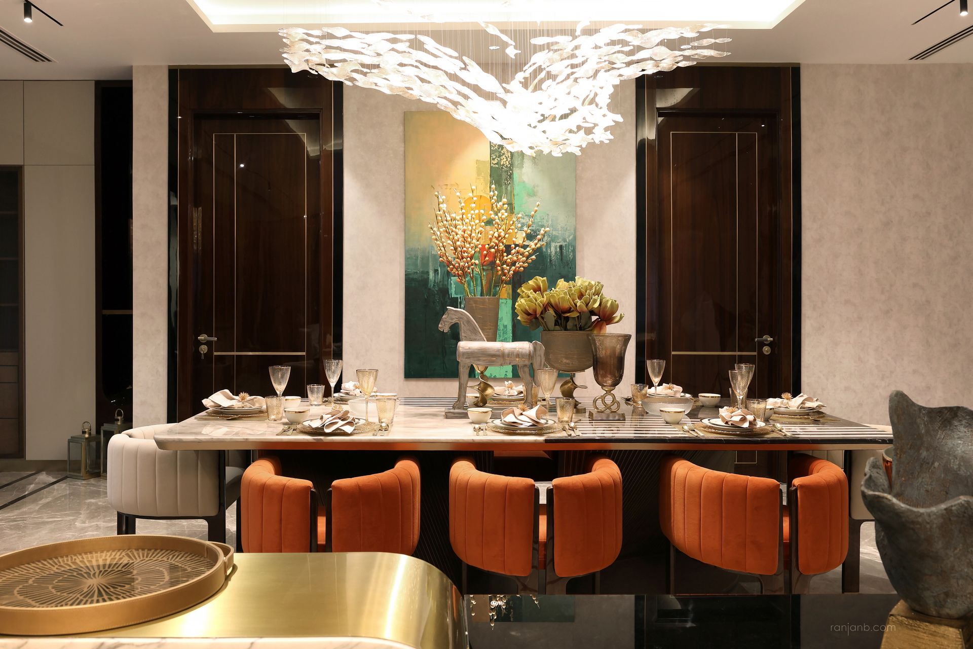 Opulent dining room with bold colors and chandelier at Urbana, photographed by Ranjan Bhattacharya.