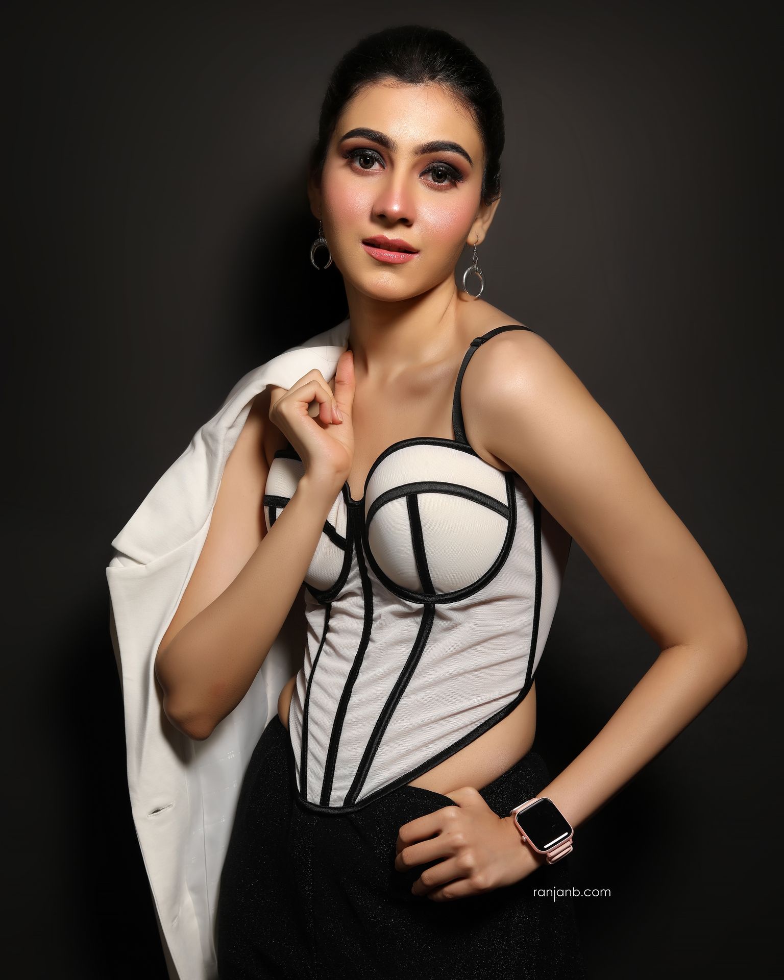 Nayonika Gangoly during her portfolio photoshoot — a moment of confidence captured by Ranjan Bhattacharya. Portrait of Nayonika Gangoly in a monochrome corset and white blazer, photographed by Ranjan Bhattacharya during her portfolio shoot in Kolkata studio.