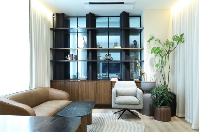 Corporate office interior photography highlighting lounge area and shelving design