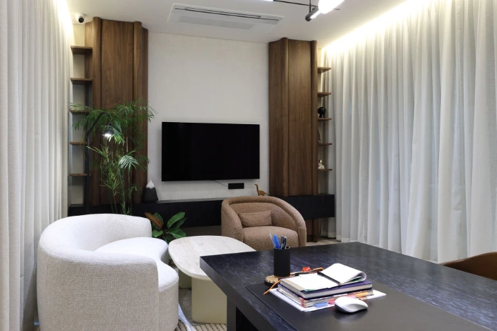 A real working cabin captured thoroughly, focusing on completeness rather than quick approvals Corporate office cabin photographed with curtains drawn, showing a functional executive workspace without styling shortcuts