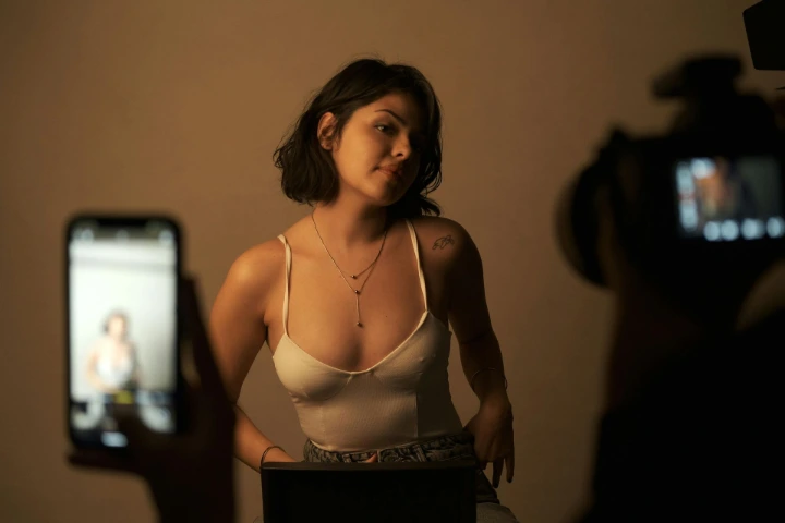 Professional undergarment advertising photoshoot with controlled studio lighting and model coordination controlled studio lighting during a professional undergarment advertising photoshoot