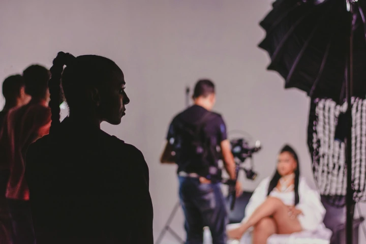 Behind-the-scenes of a professional advertising photoshoot with controlled lighting and direction specialised advertising photographer managing lighting and camera during an innerwear campaign shoot