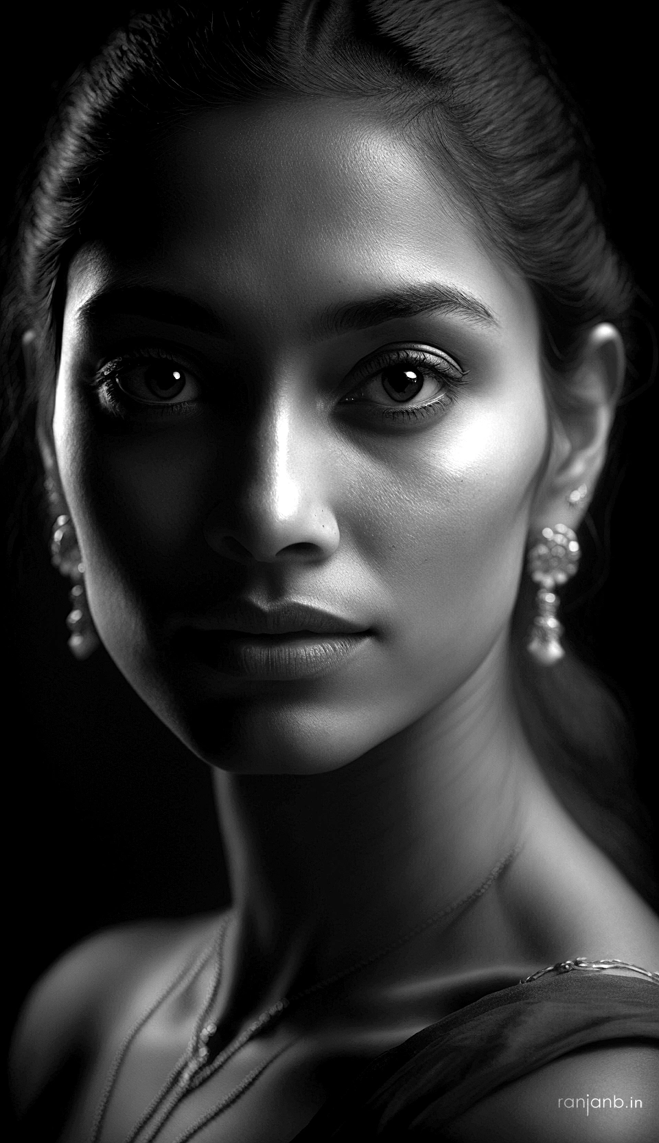 Black & White Portrait of a Mumbai Model by Ranjan Bhattacharya Black and white close-up portrait of a Mumbai model with traditional jewelry, captured by Ranjan Bhattacharya.