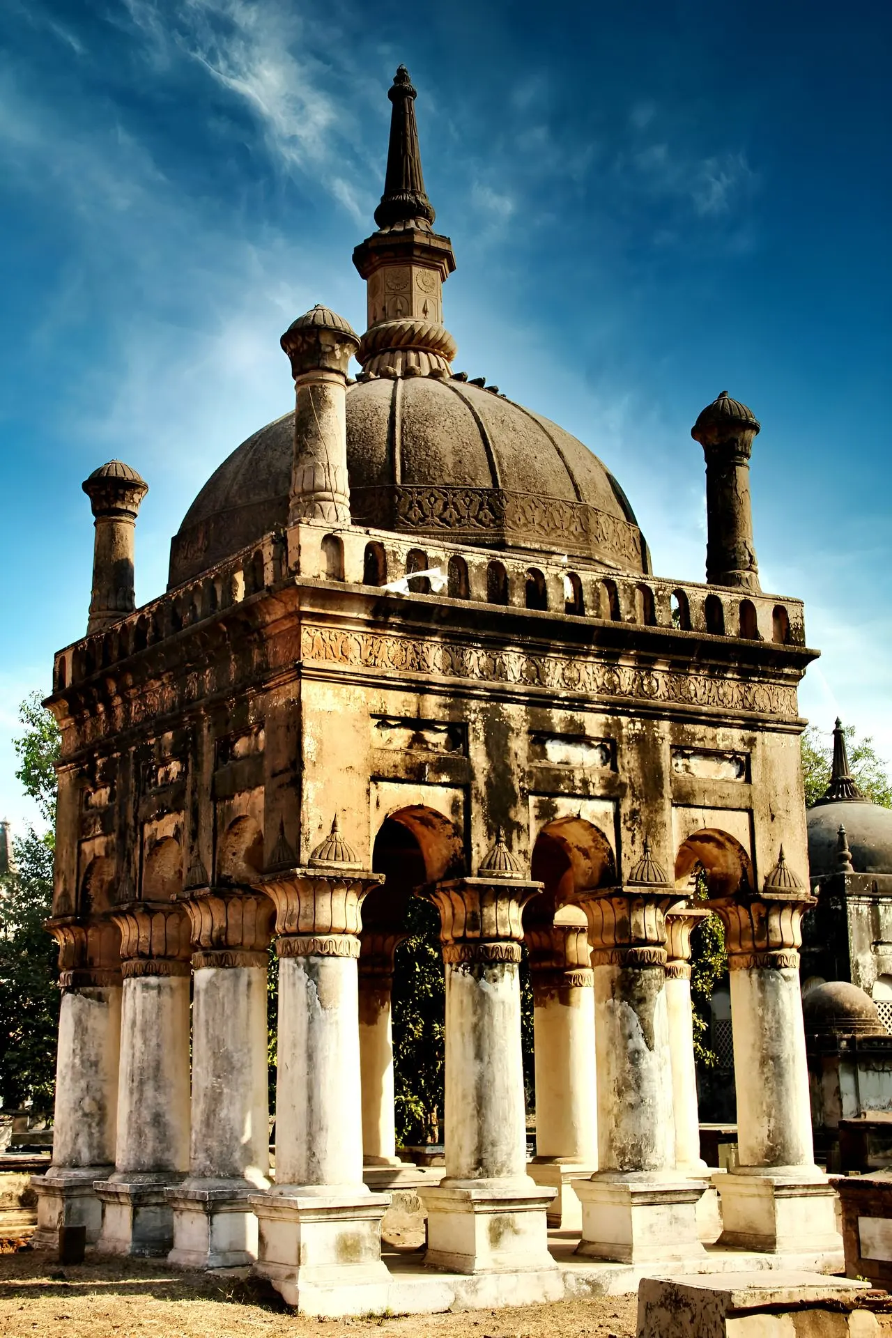 A brown concrete heritage building under blue sky during sunset 