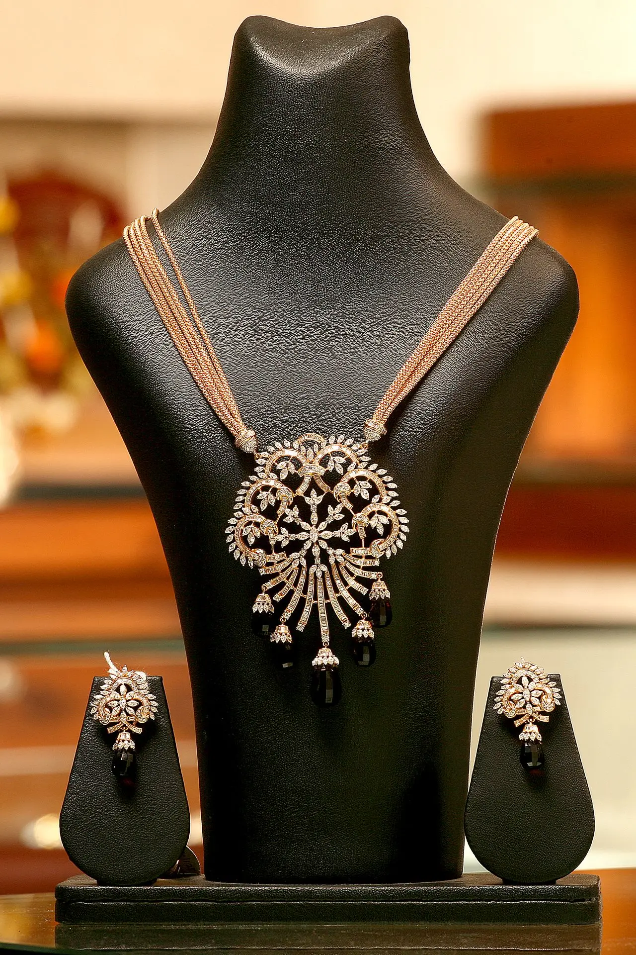 Mannequin showcasing necklaces and earrings, professional jewelry photography.