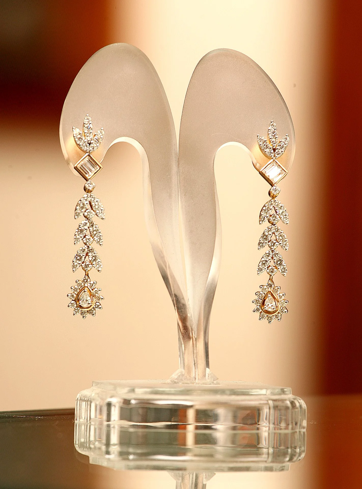 Detailed shot of earrings on a display stand, creative backdrop.