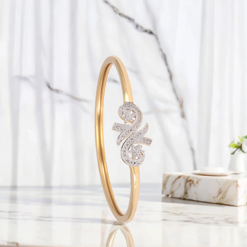 A beautifully diamond crafted gold bangles photographed against a natural background by th best product photographer Ranjan Bhattacharya in Kolkata.