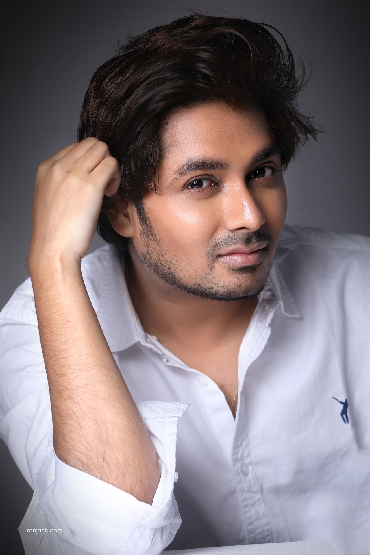 Actor Portfolio Shoot – Comfort Building Phase Actor portfolio photography session in Kolkata featuring Shayan Mitra in a white shirt during an early comfort-building phase