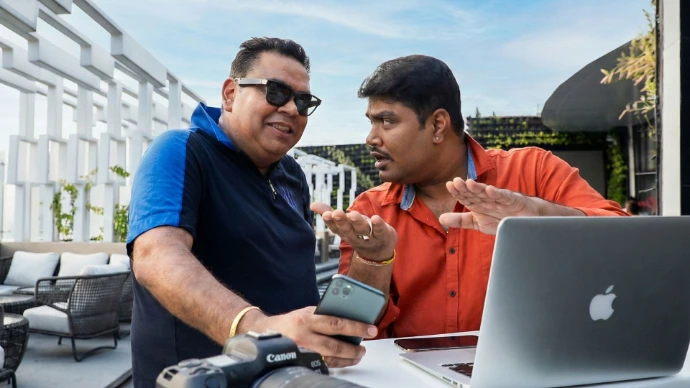 Advertising campaign strategy meeting with client during pre-production planning for commercial shoot in India.