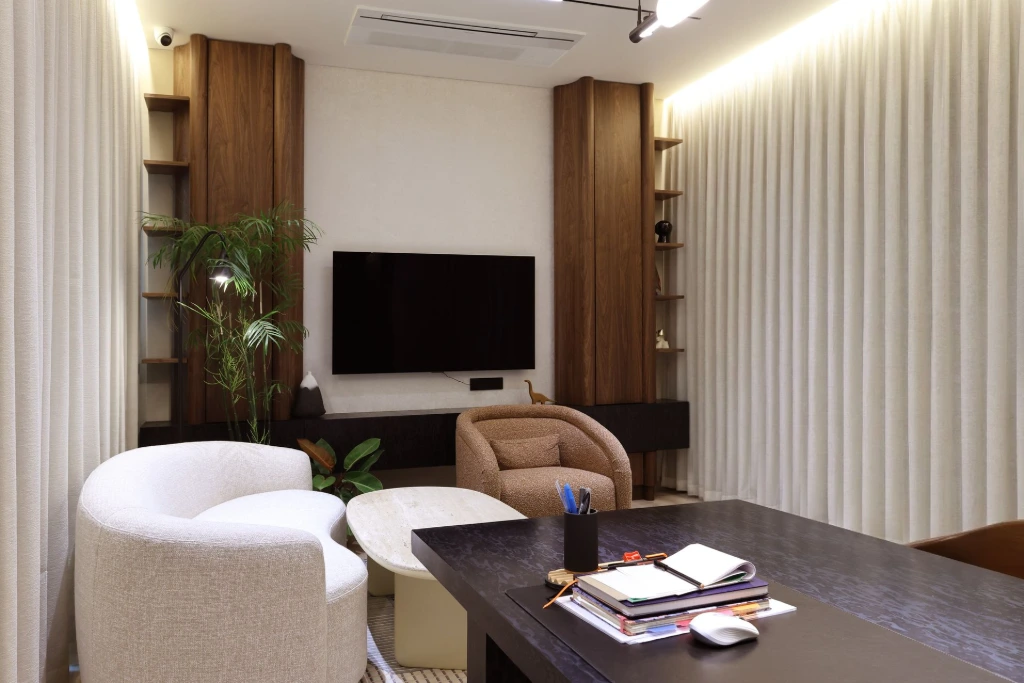 A real working cabin captured thoroughly, focusing on completeness rather than quick approvals Corporate office cabin photographed with curtains drawn, showing a functional executive workspace without styling shortcuts