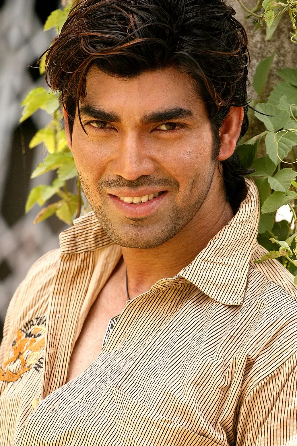 A professional male model posing for a portfolio by the best portfolio photographer in Kolkata