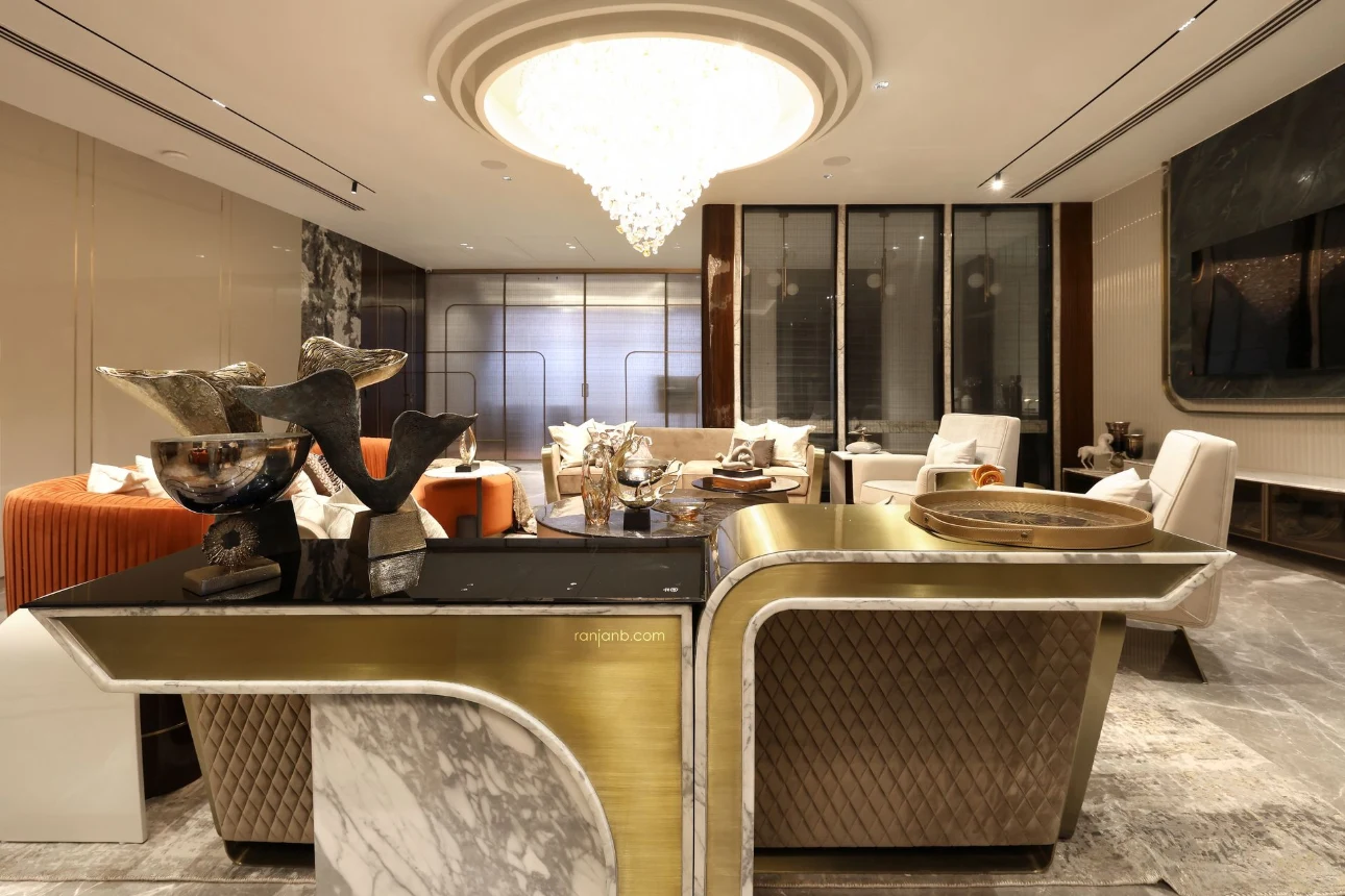 Luxurious living room at Urbana Kolkata — photographed by Ranjan Bhattacharya, featuring marble decor, designer furniture, and chandelier lighting.
