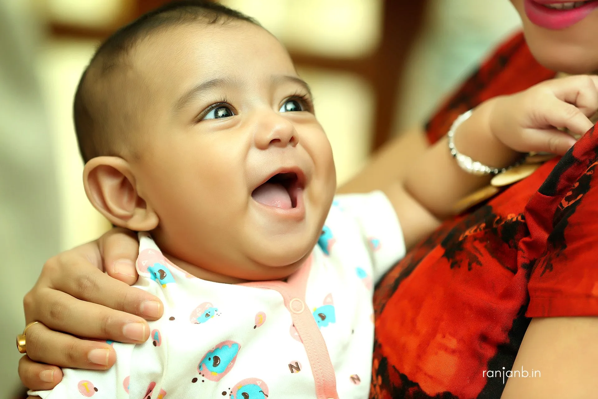 A Joyful candid moment of Kiaan on his first rice ceremony, captured by Ranjan Bhattacharya.