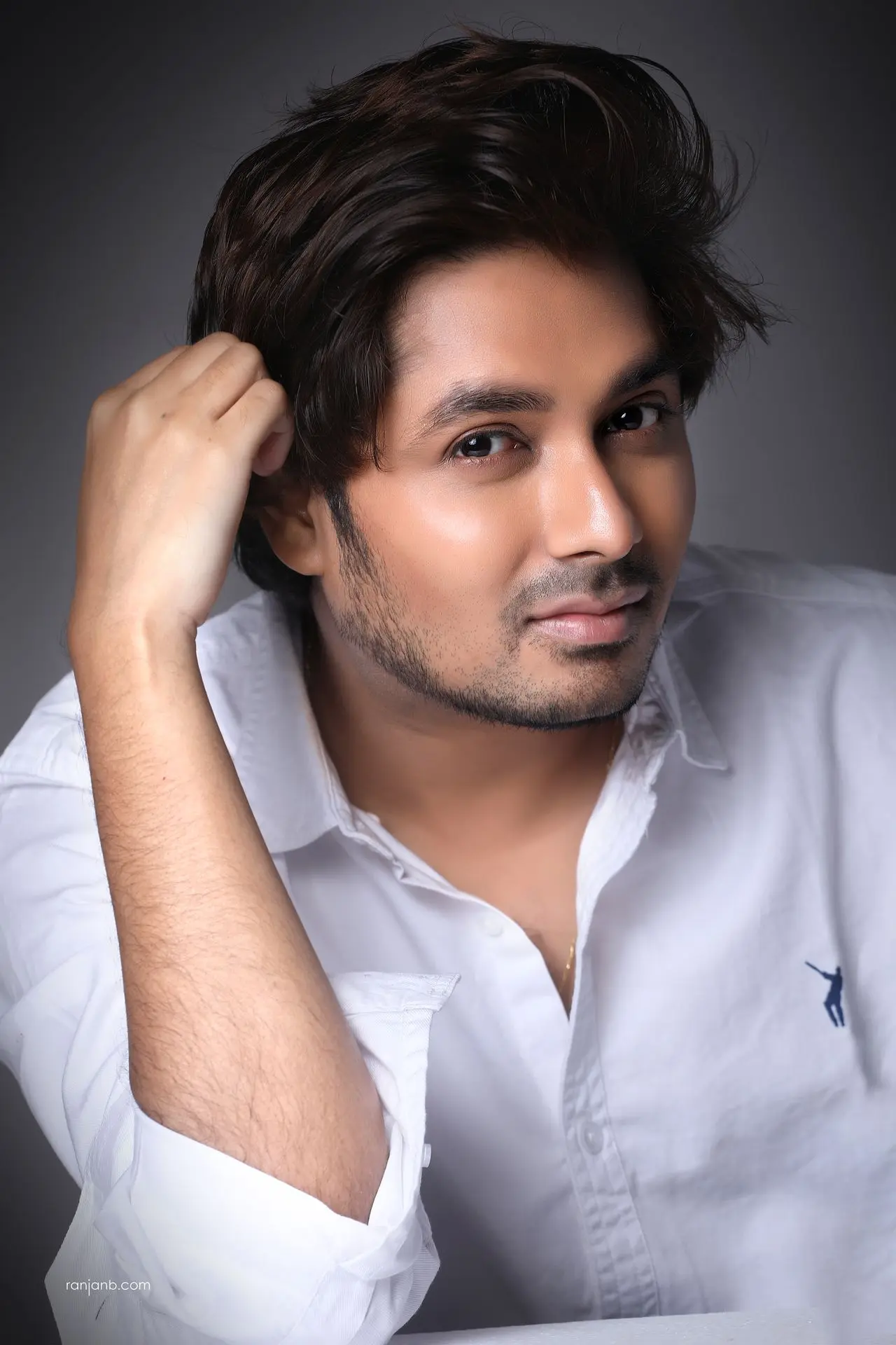 Actor portfolio photography session in Kolkata featuring Shayan Mitra in a white shirt during an early comfort-building phase