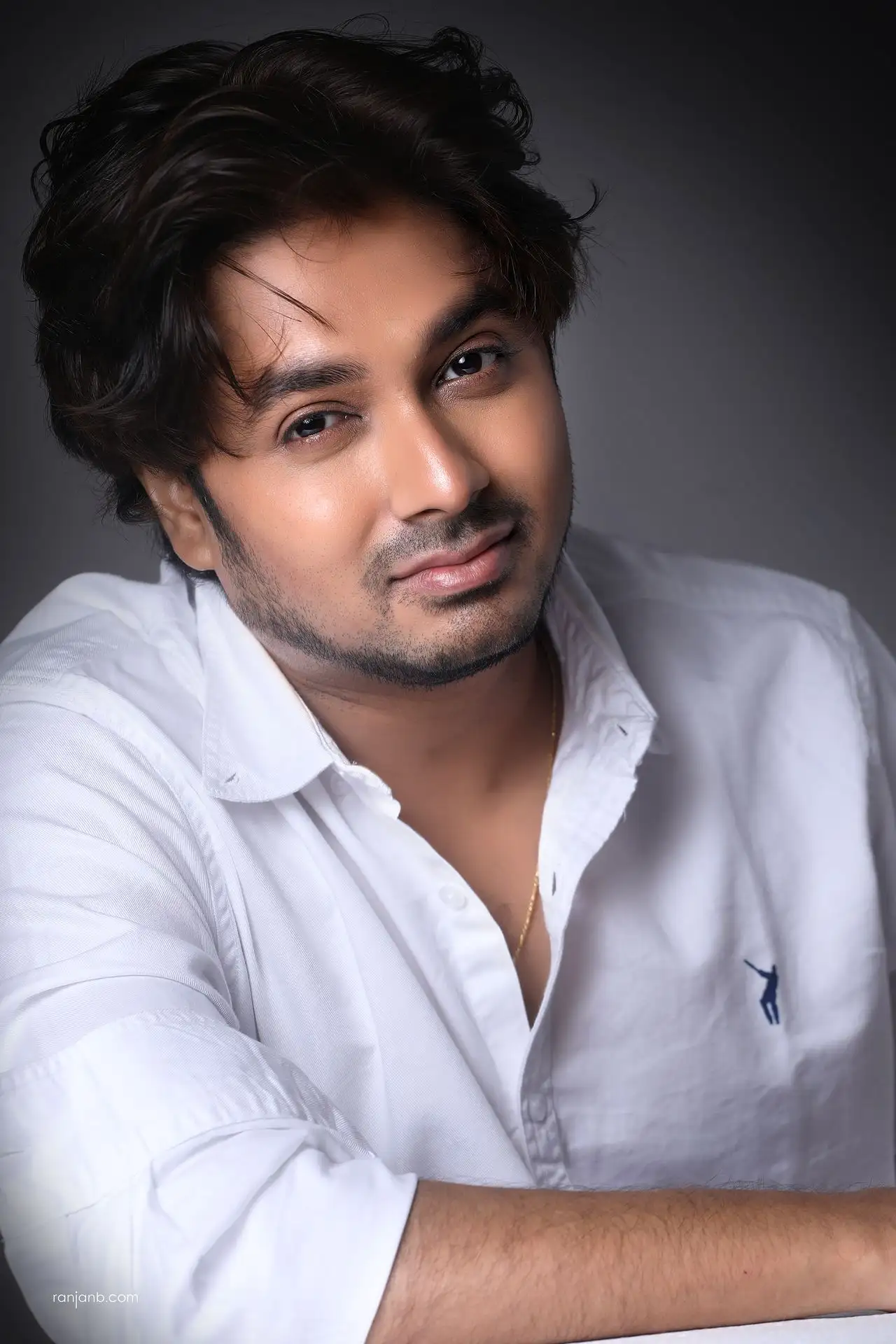 Actor portfolio photography session in Kolkata during the comfort-building stage with natural white shirt lighting