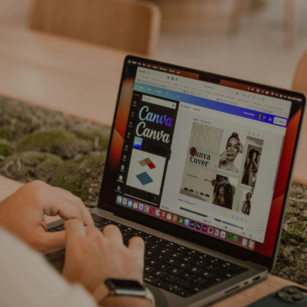 Photographer editing a portfolio website layout with gallery images on a laptop