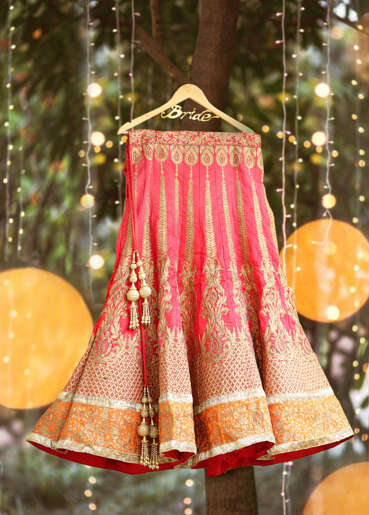 Lehenga hanging in an outdoor garden, captured by Ranjan Bhattacharya