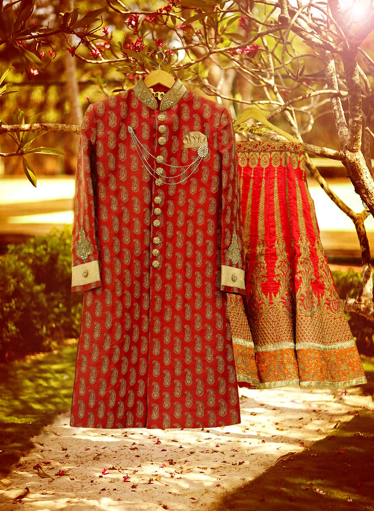 Wedding Sherwani & Lehenga hanging in an outdoor garden, captured by Ranjan Bhattacharya at Kolkata.