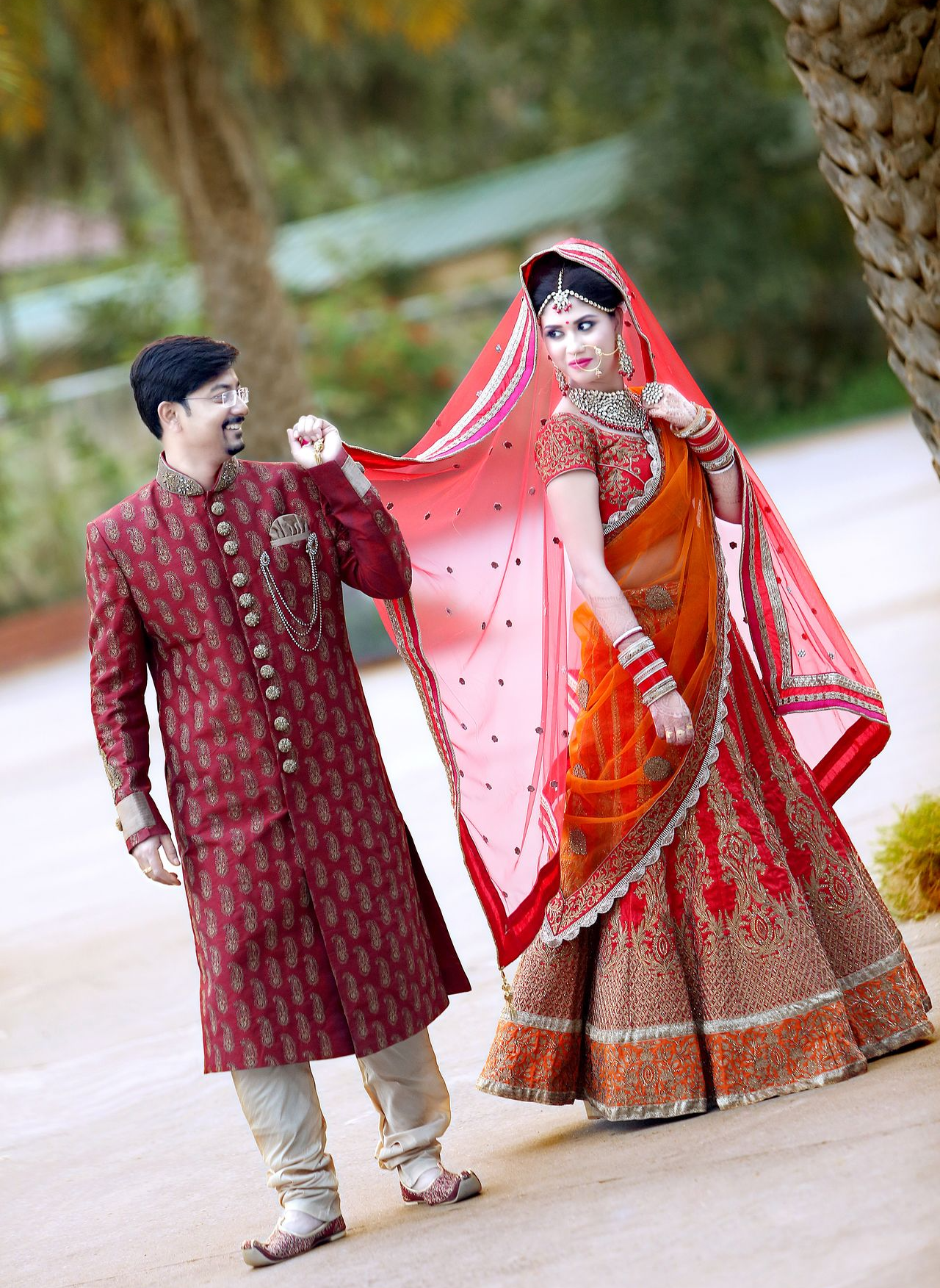 Bride and Groom having fun while walking, Wedding Photography by the Best Wedding Photographer in Kolkata - Ranjan Bhattacharya