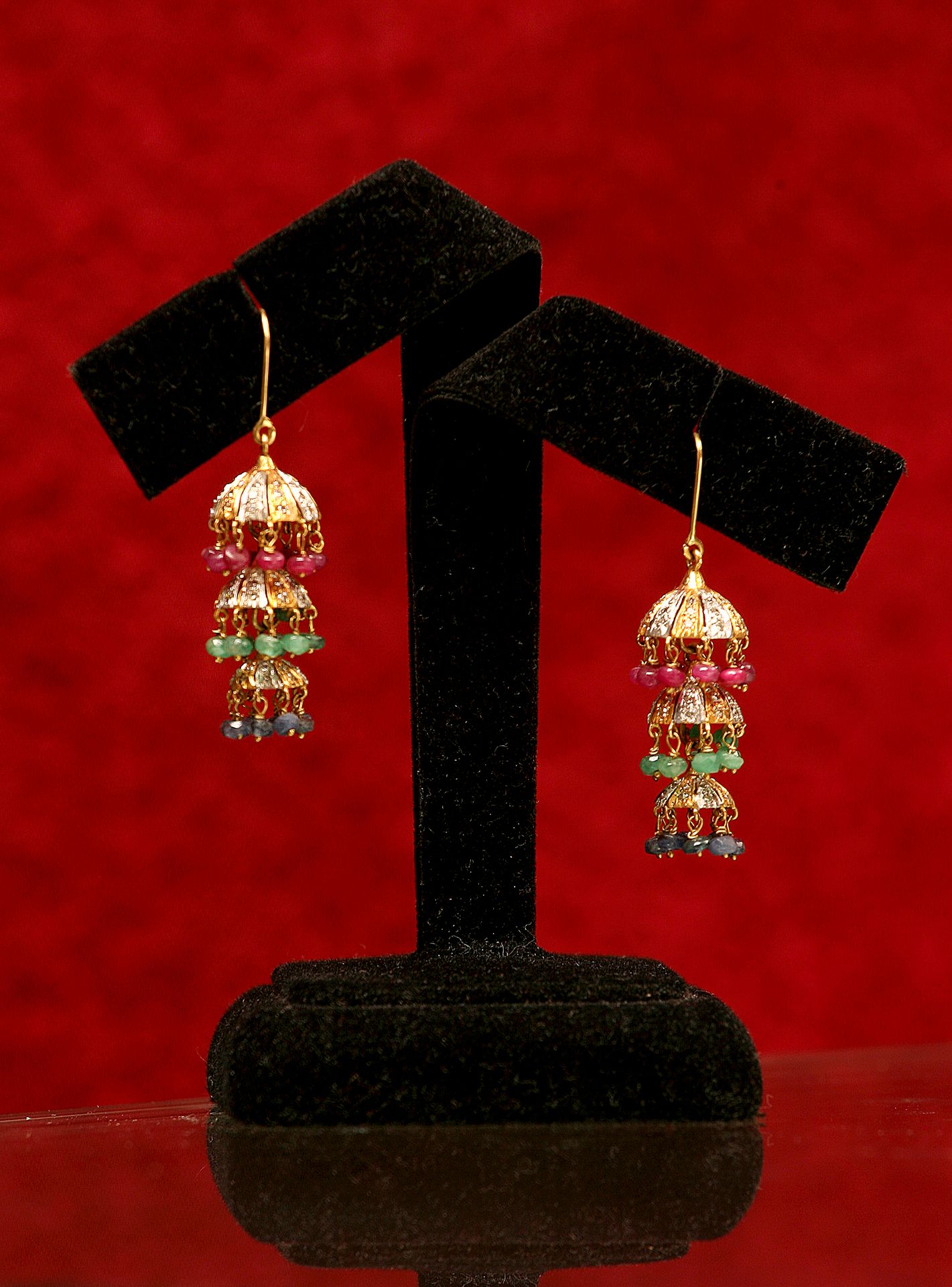 Detailed shot of earrings on a display stand, creative backdrop.